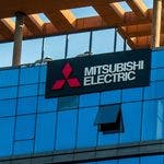 Insegna Mitsubishi Electric su edificio moderno blu