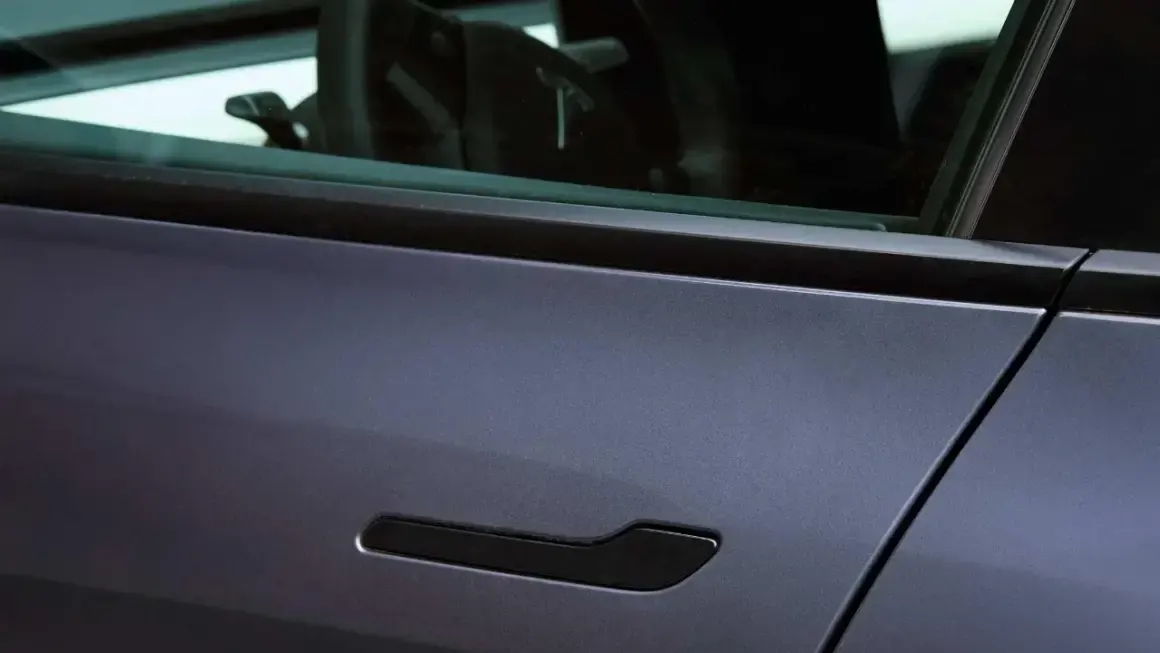 tesla model y door system