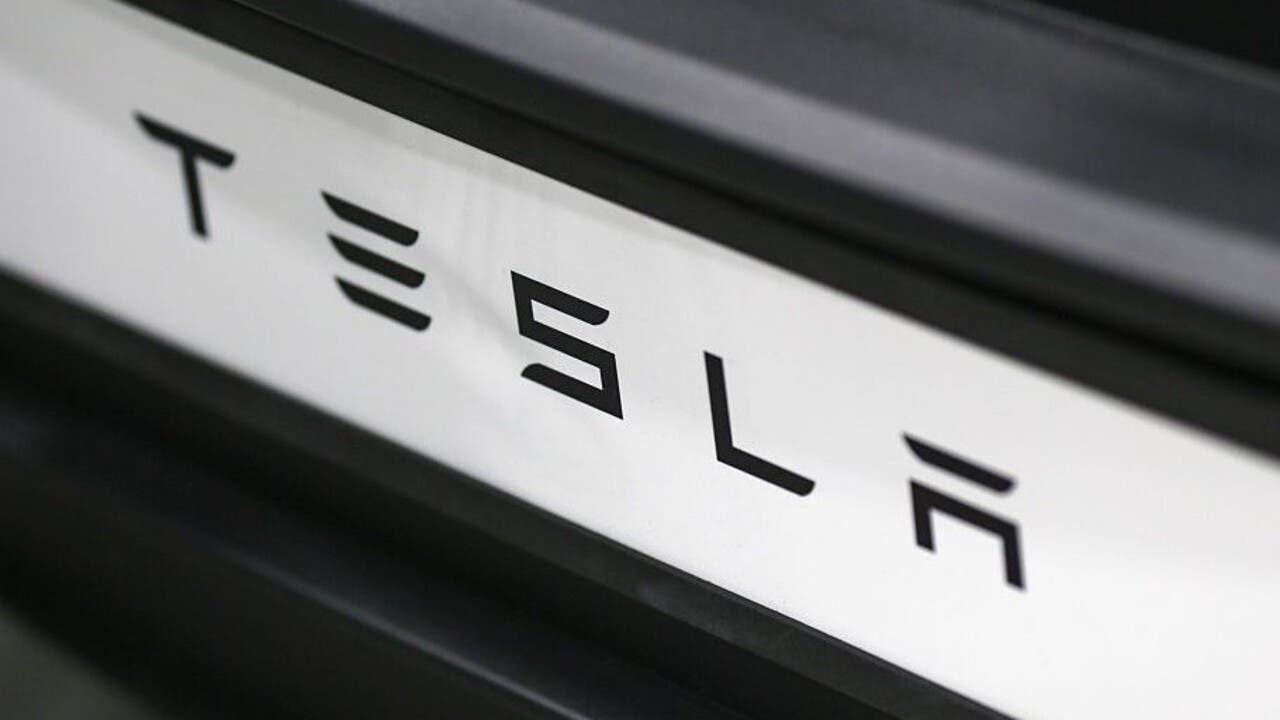 tesla badge