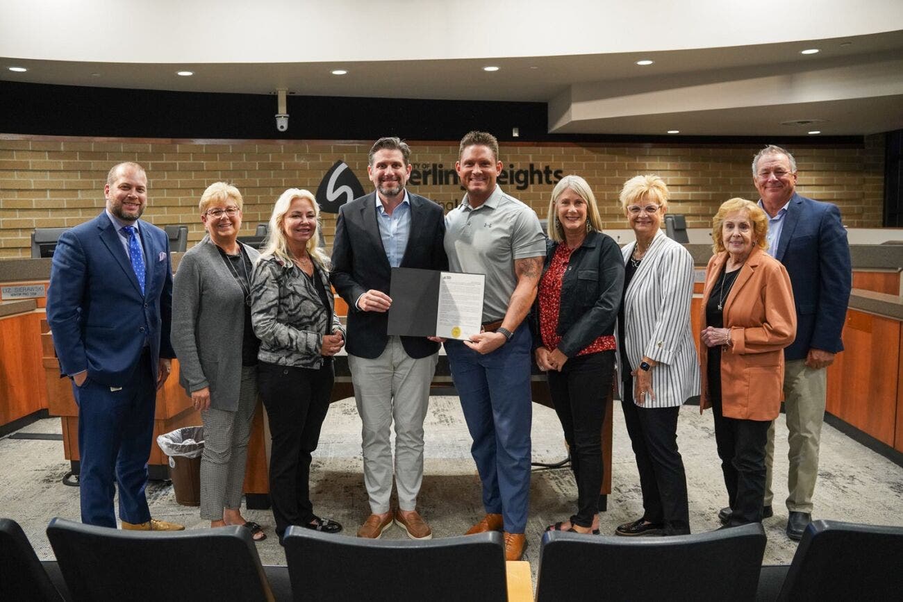 Sterling Heights Mayor Michael C. Taylor, center left, and Sterl
