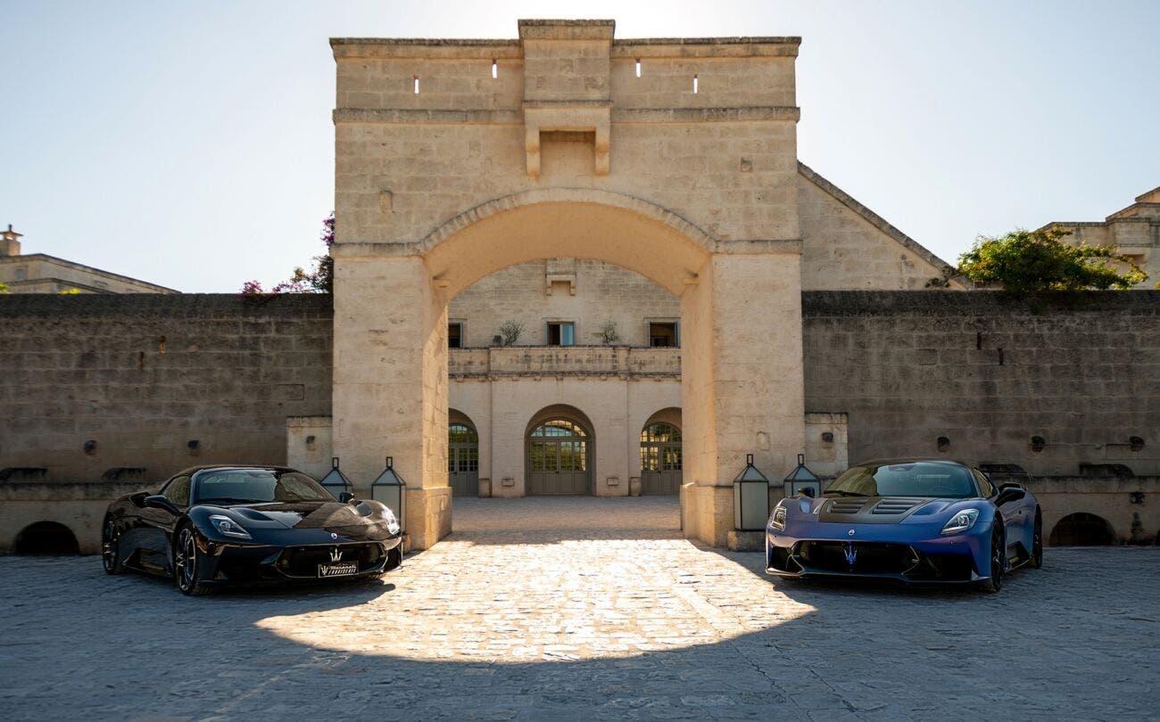 Maserati MCPura Cielo convertible parked on a road, side view, with the roof open